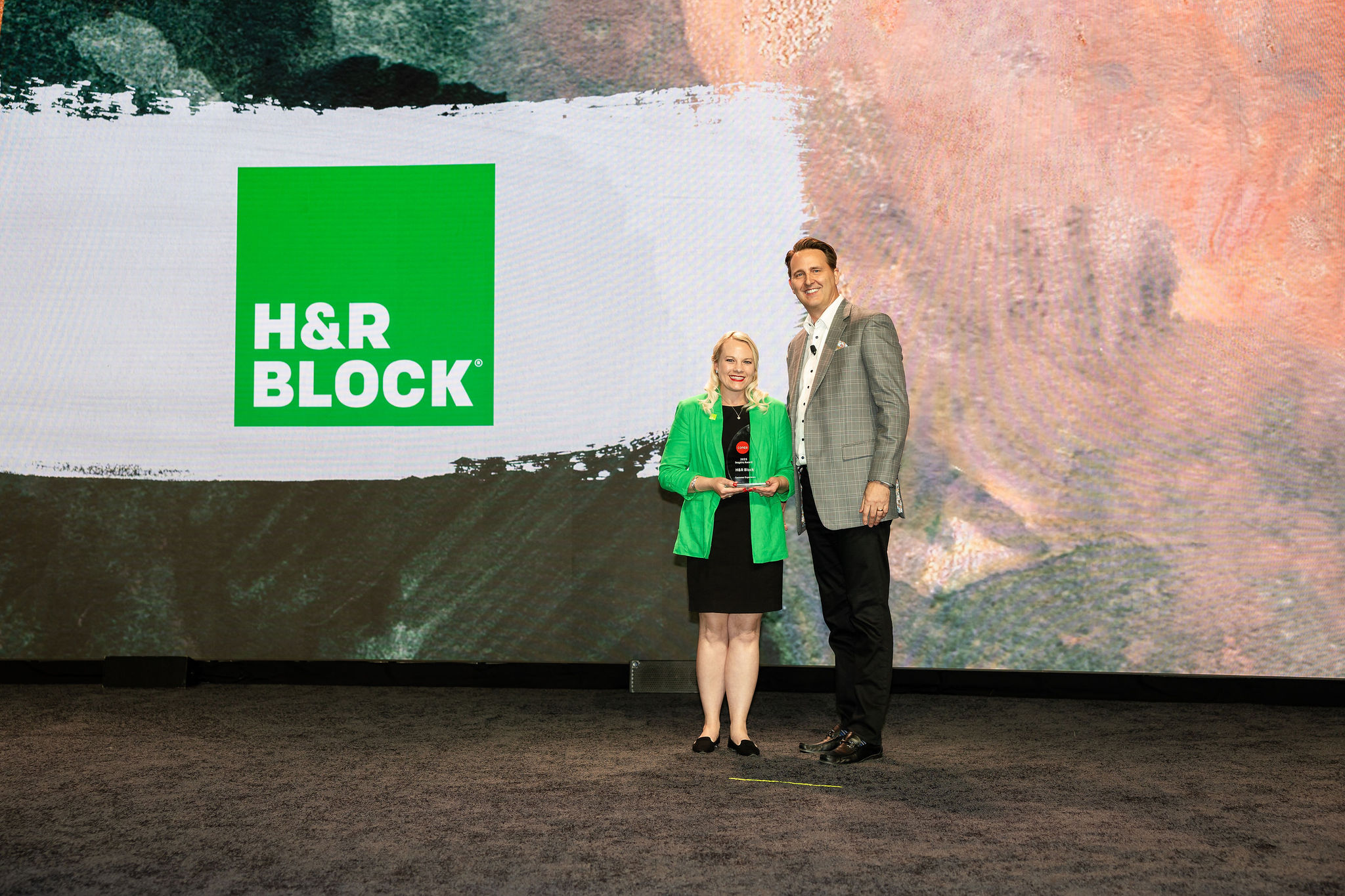 H&R Block receiving Conga award