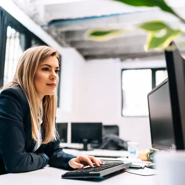 Woman using Conga software on laptop