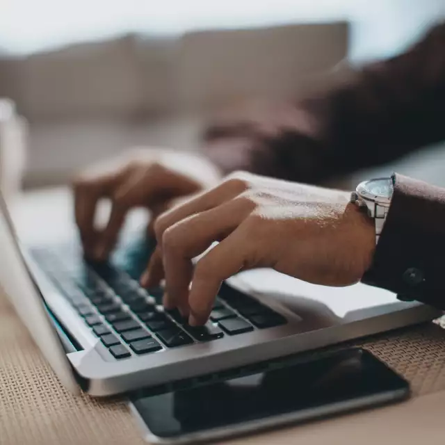 Man using Conga's Automate Revenue suite on laptop