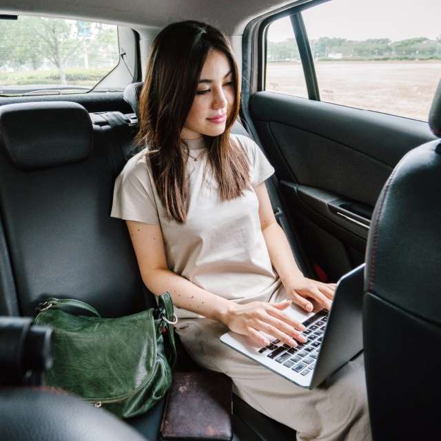 Woman using Conga Automate Revenue Suite in car