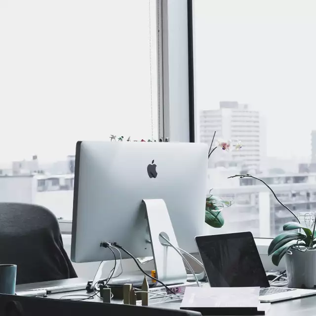 Empty office with computer and city view