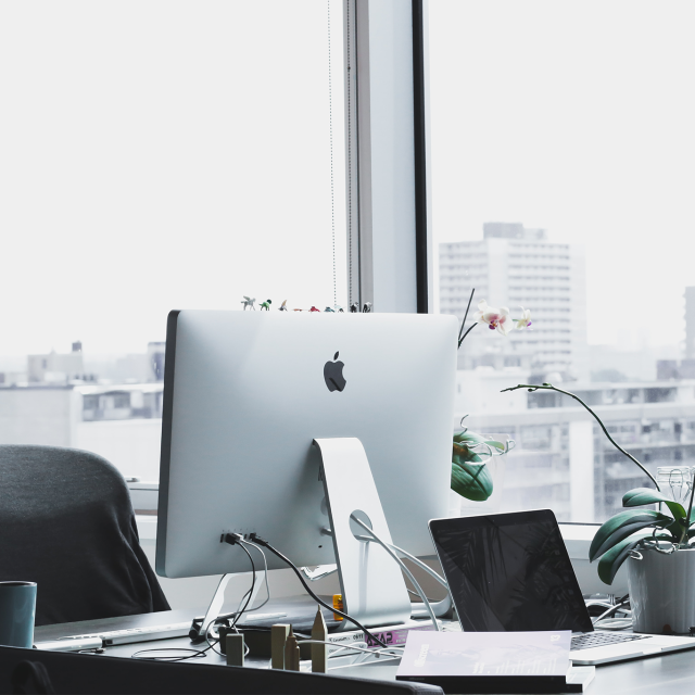 Empty office with computer and city view