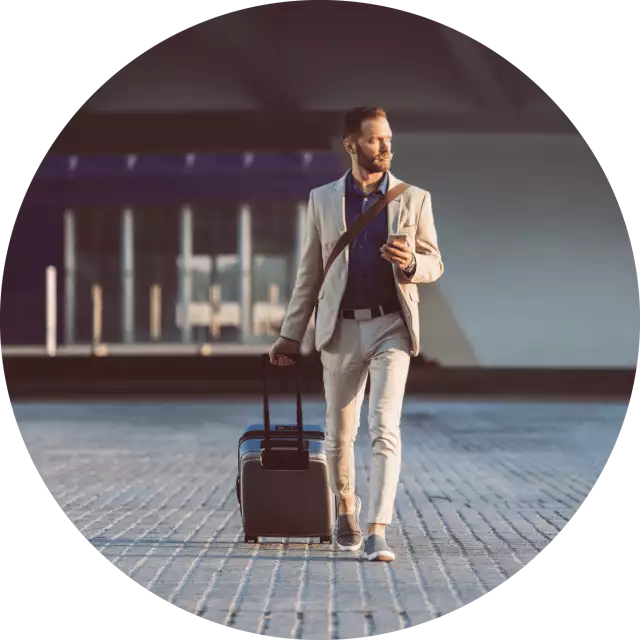 Man walking and holding a suit case