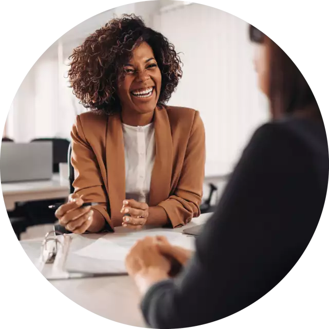 Woman smiling at desk