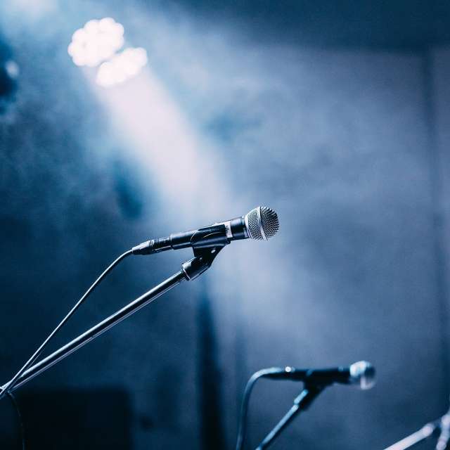 Microphones in the spotlight on a stage