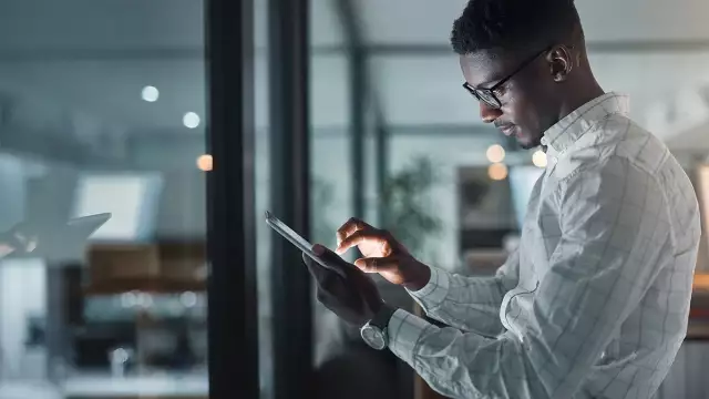 Man looking at tablet