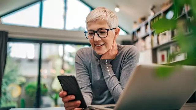 Woman smiling on cell phone