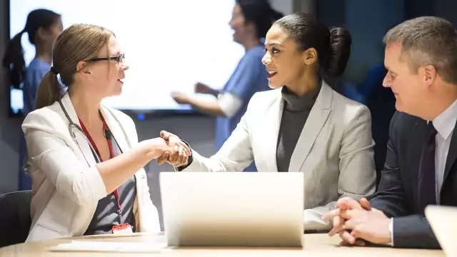 Legal professionals shaking hands