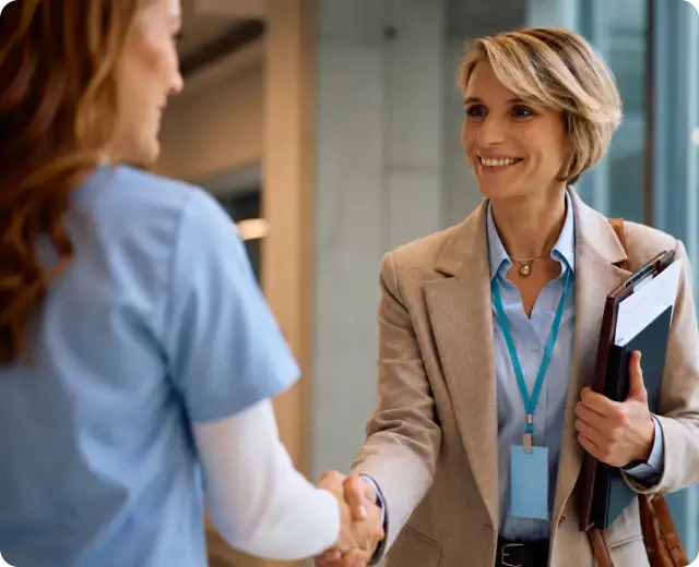 Healthcare workers shaking hands