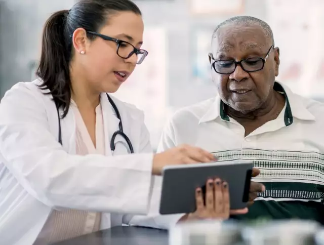 Nurse speaking to patient