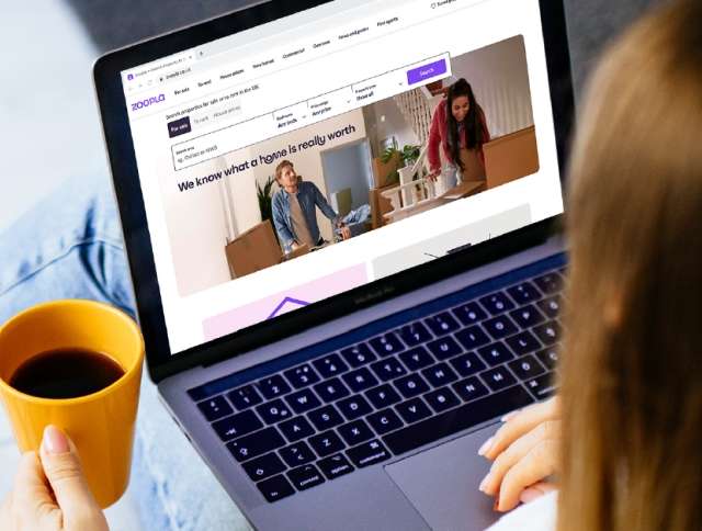 Woman looking at Zoopla's website
