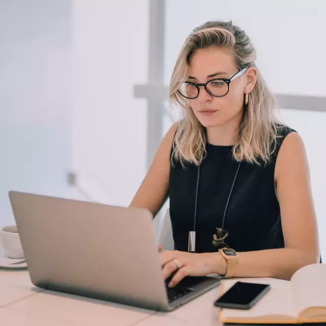 Woman working on laptop using Conga software