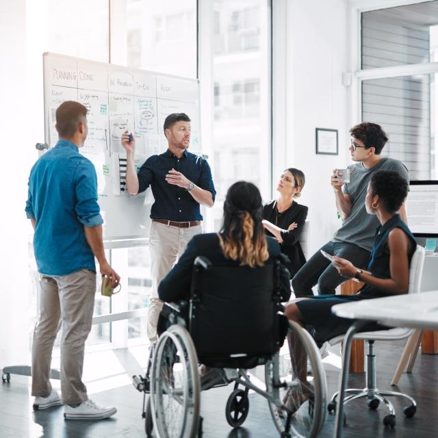 Team white-boarding session about contracts
