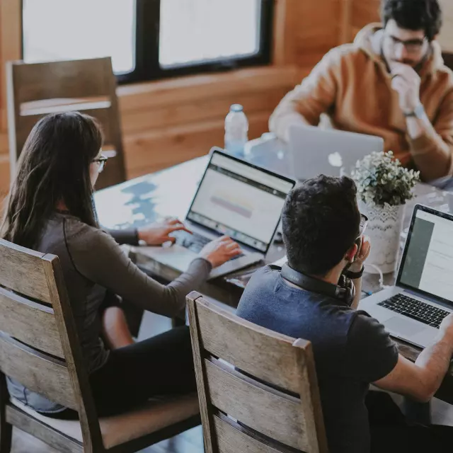 Employees working on computers in office