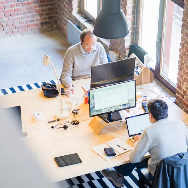 Overhead shot of men working in an office