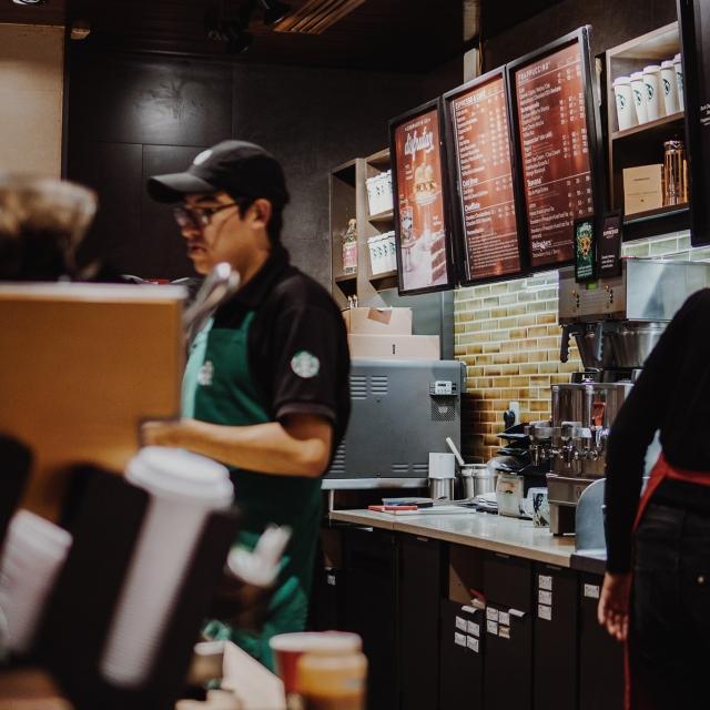 Starbucks employee taking orders