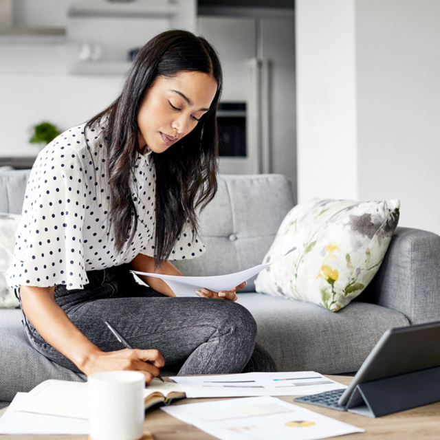 Woman working from home on her couch