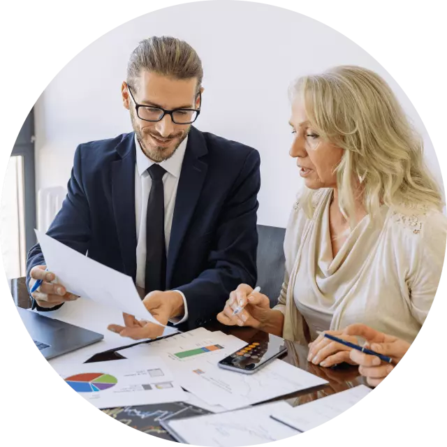 Man and woman discussing a report 