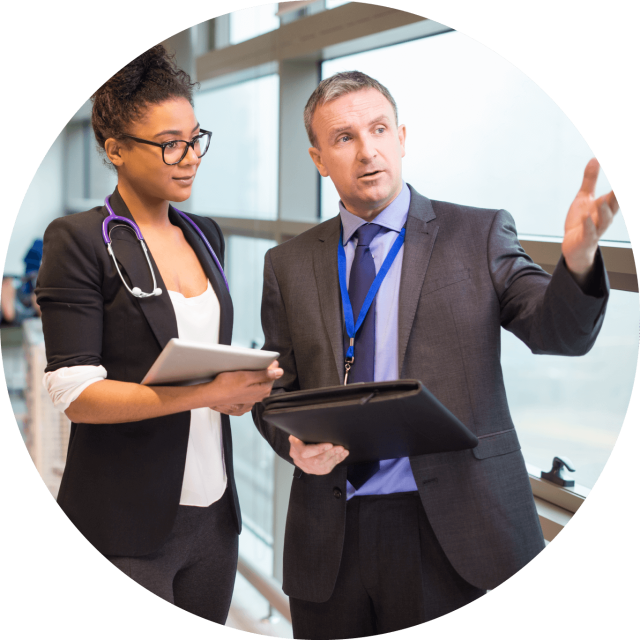 A doctor talking to a man in a suit