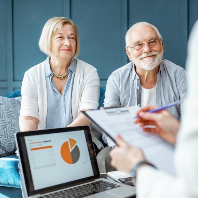 Older couple speaking to a doctor