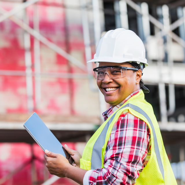 Construction woman looking at tablet