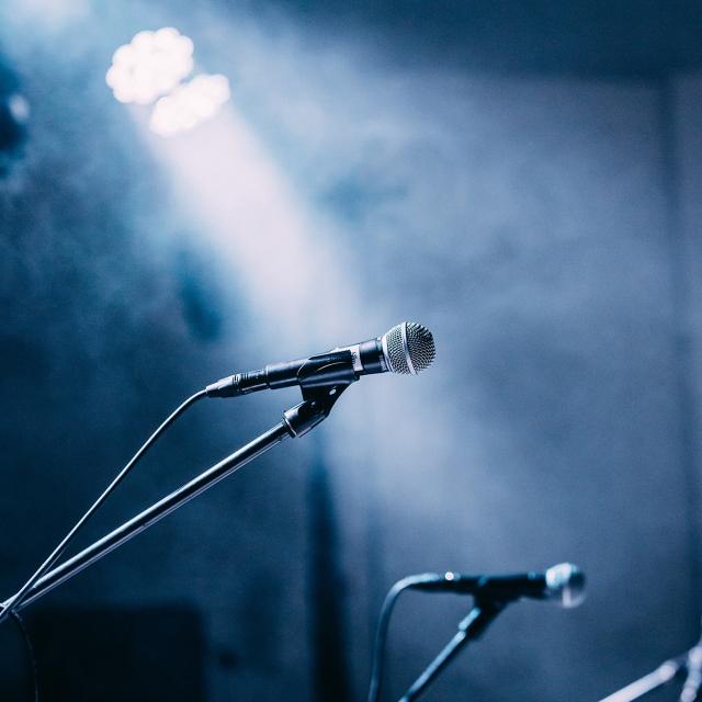 Microphones in the spotlight on a stage