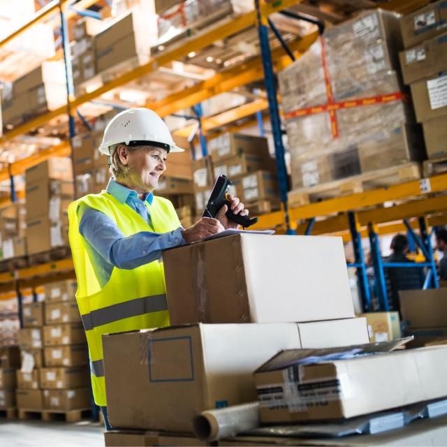 Woman sealing a package