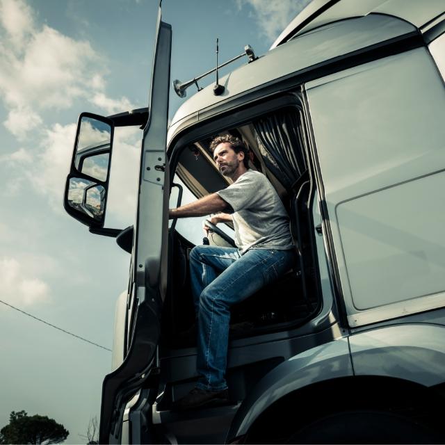 Truck driver exiting vehicle