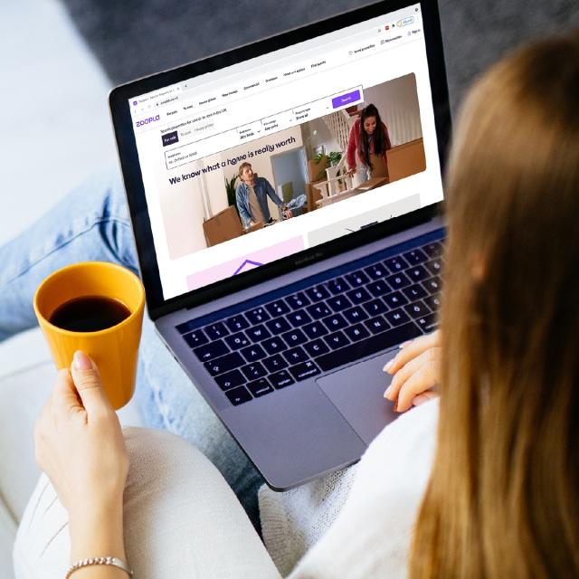 Woman looking at Zoopla's website