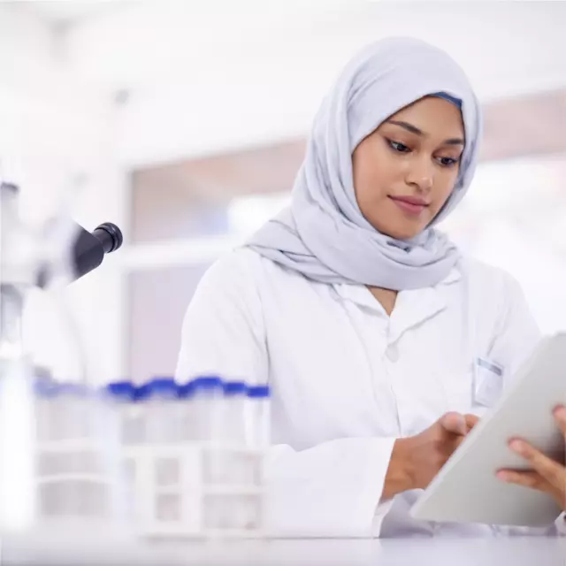 Woman in lab using tablet