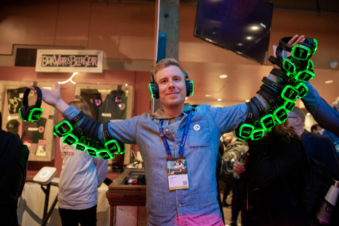 Conga employee holding VR sets at an event