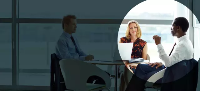 Coworkers having discussion at table