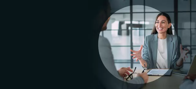 Two women talking in workplace