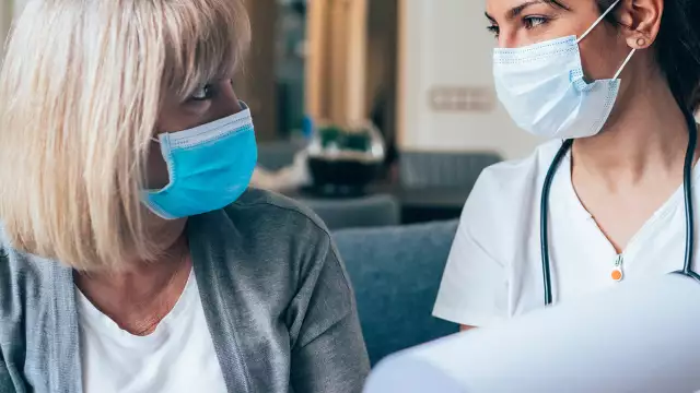Doctor explaining medical charts to patient