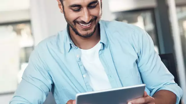 Man looking at tablet