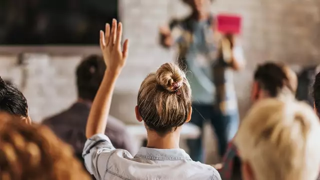 Woman raising hand