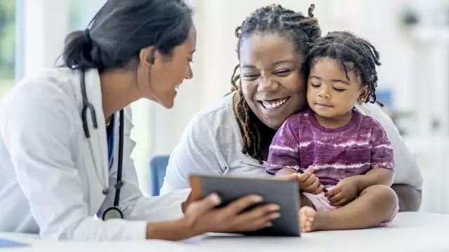 Mom and daughter in doctor's office