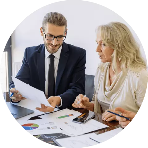 Man and woman discussing a report 
