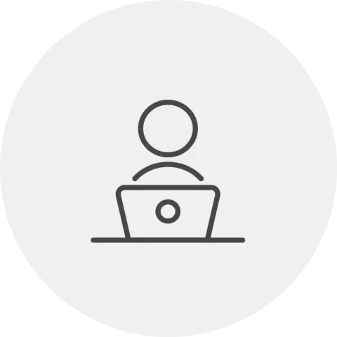 Person working from laptop icon