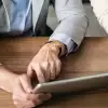 Coworkers looking at tablet