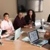 Coworkers sitting at conference table